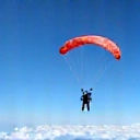 Small aircraft soaring through a clear blue sky, representing the aircraft ride.