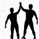 Two skydivers landing safely and high-fiving, showing celebration and success.