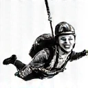 Two skydivers in freefall, smiling and enjoying the rush, representing the freefall experience.